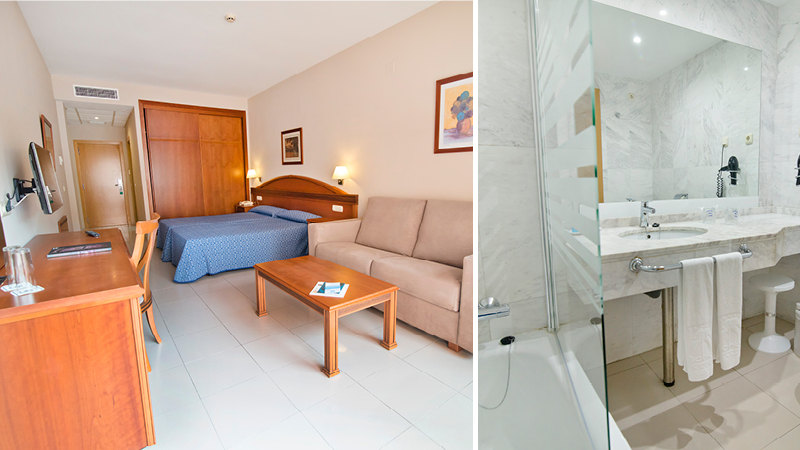 Rymligt dubbelrum med soffa och badrum med dusch p hotell Bahia Tropical i Almunecar, Andalusien.